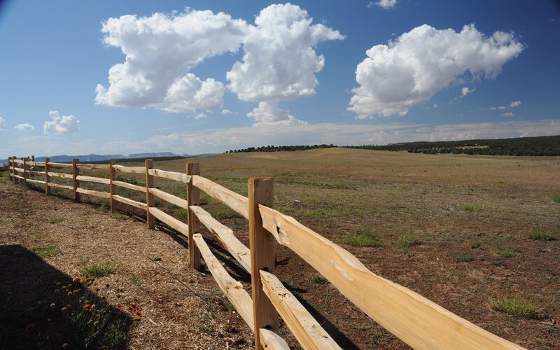 Wooden fence in open field