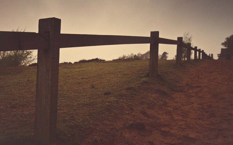 Wooden fence on a hillside