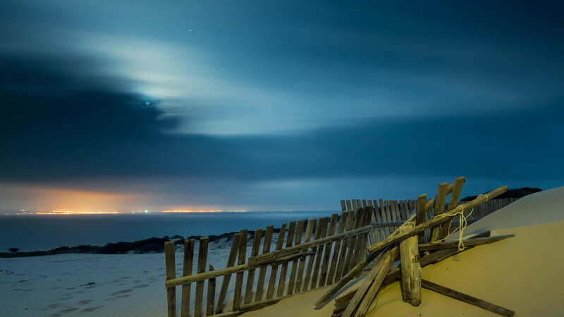 Wooden Fence on Sand Dune — Blue