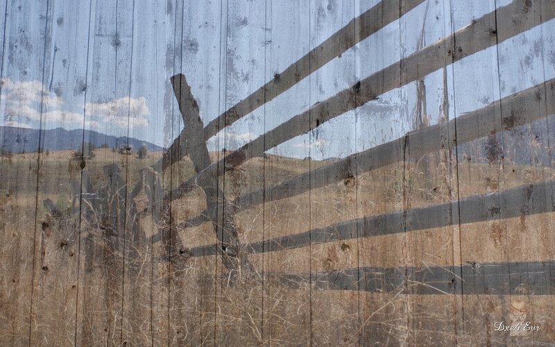 Wooden fence with landscape overlay