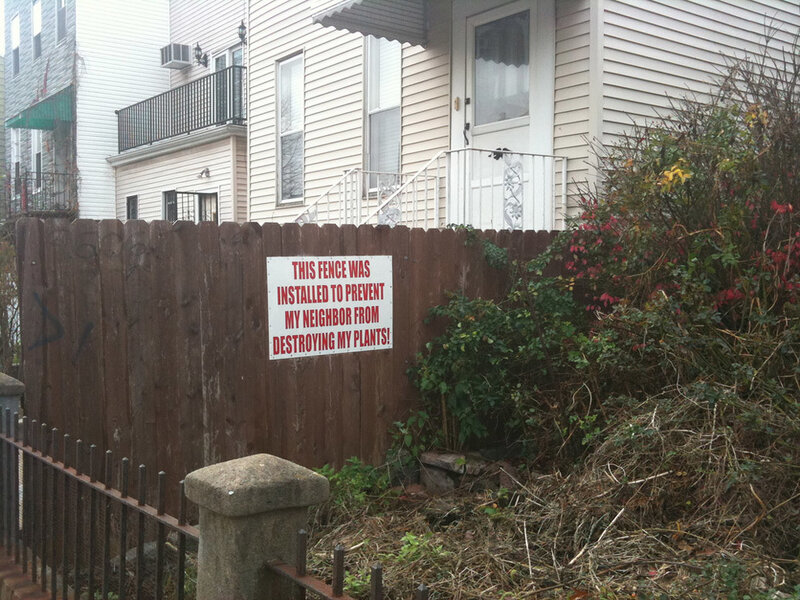 Wooden Fence with Sign