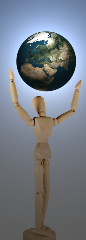 wooden figure holding globe