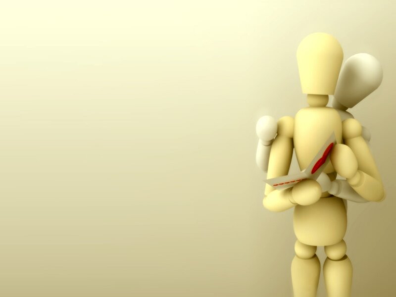 wooden figure holding letter