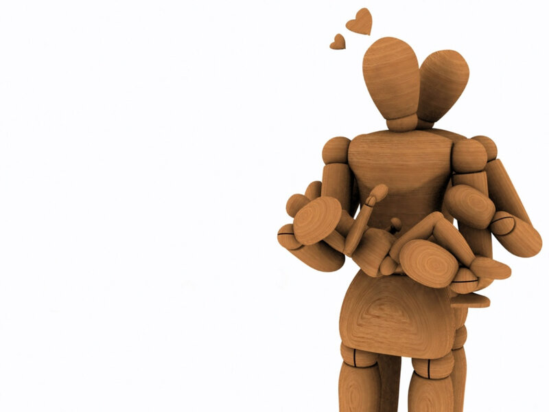 wooden figures hugging