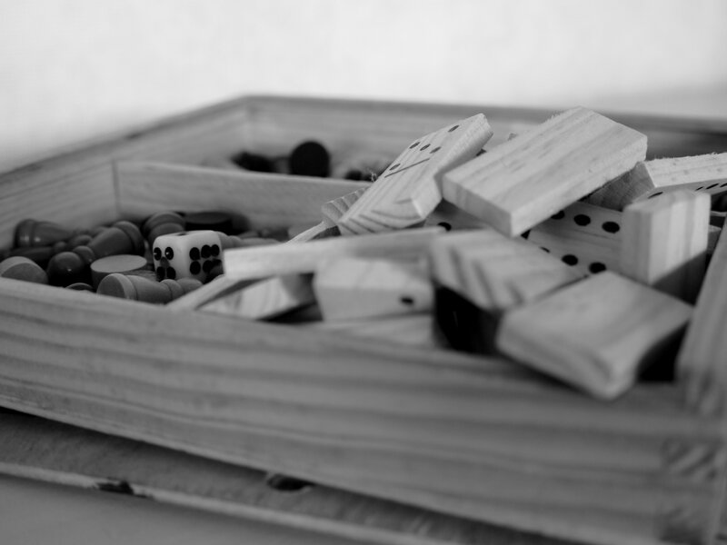 Wooden game pieces in a box
