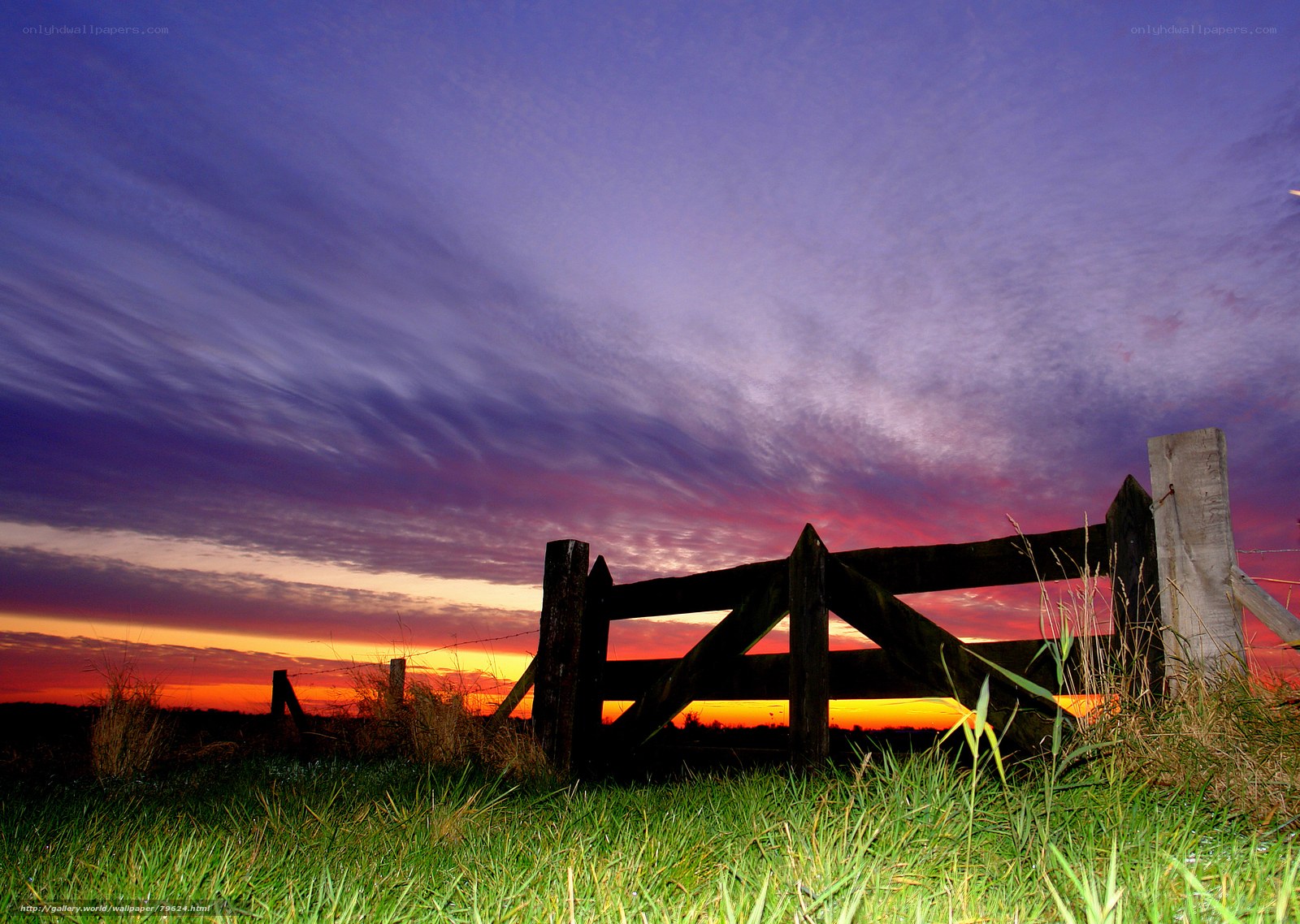 Wooden gate at sunset