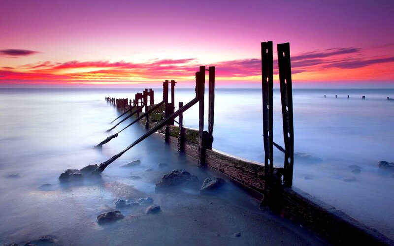 Wooden Groynes at Sunset — Purple
