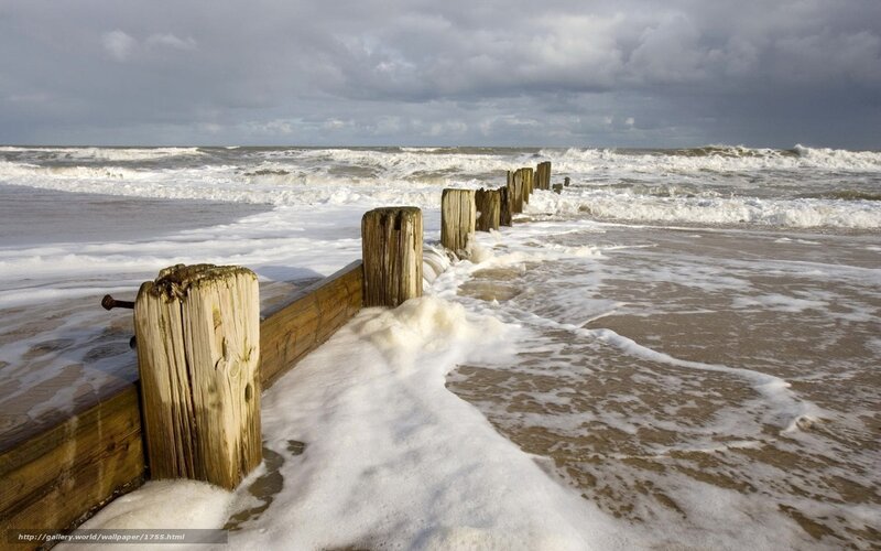 Wooden groynes on a stormy beach