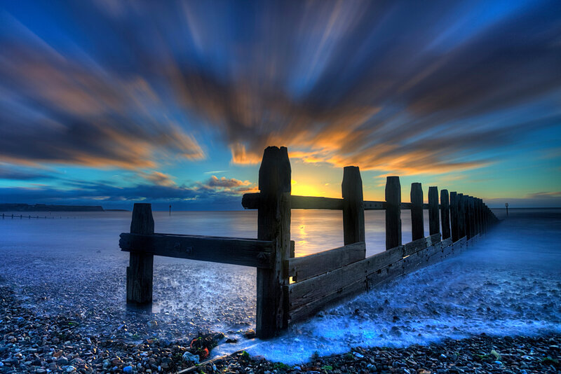 Wooden Groynes on Beach — Blue, Dramatic