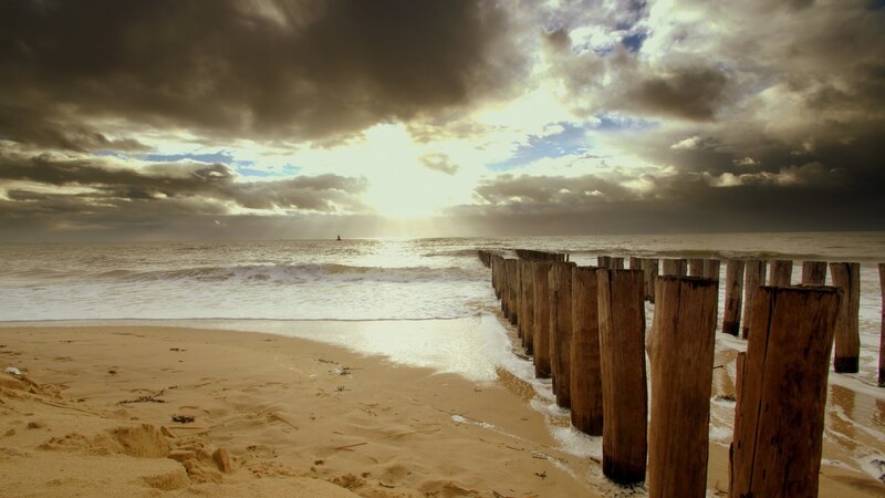 Wooden Groynes on Beach — Brown, Dramatic, Sunset, Photograph
