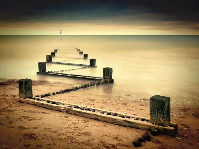 Wooden Groynes on Beach — Brown, Serene