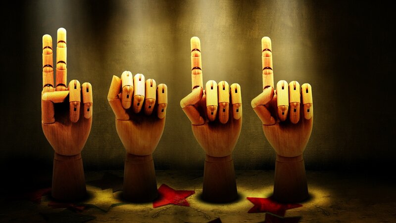 wooden hands making gestures
