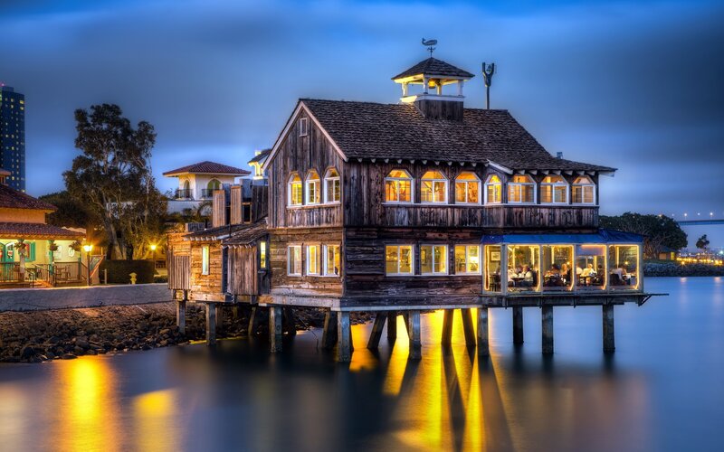 wooden house on stilts at dusk