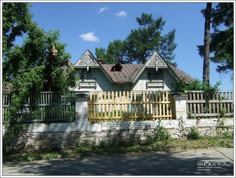 wooden house with decorative gables