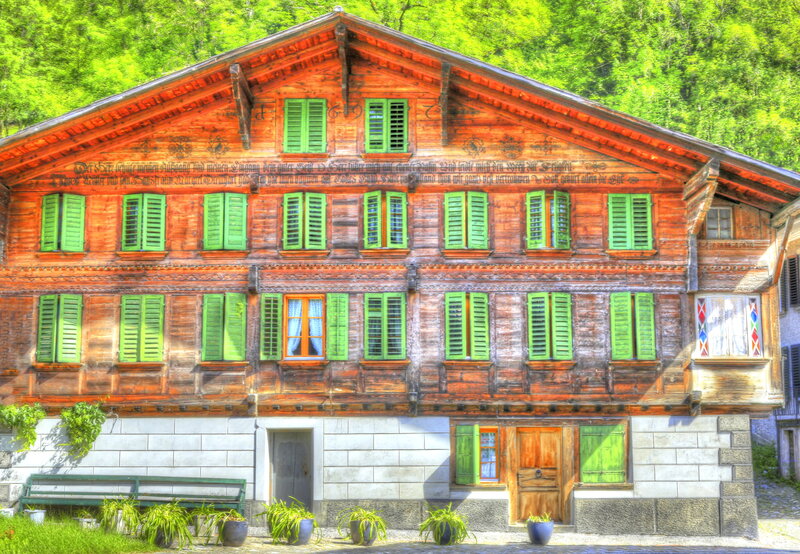 Wooden House with Green Shutters