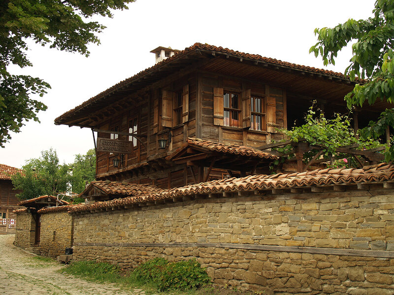 Wooden House with Stone Wall