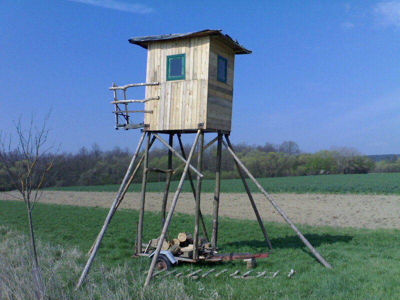 Wooden hunting blind in field