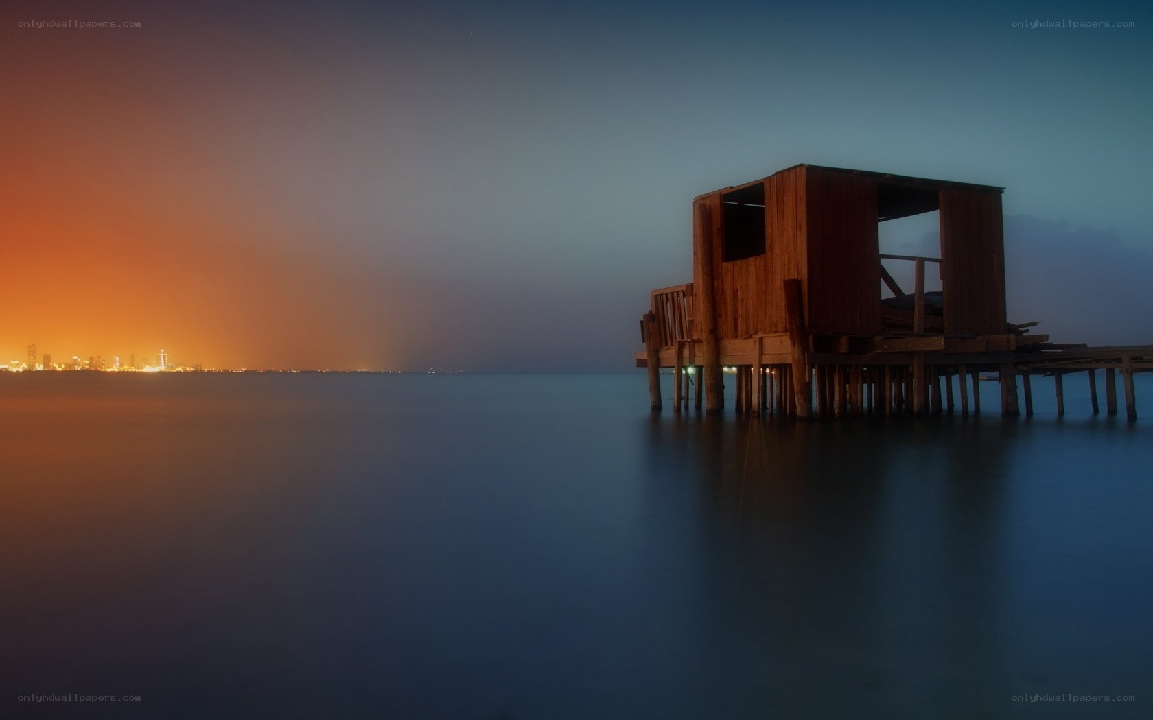 Wooden hut on a pier at dusk