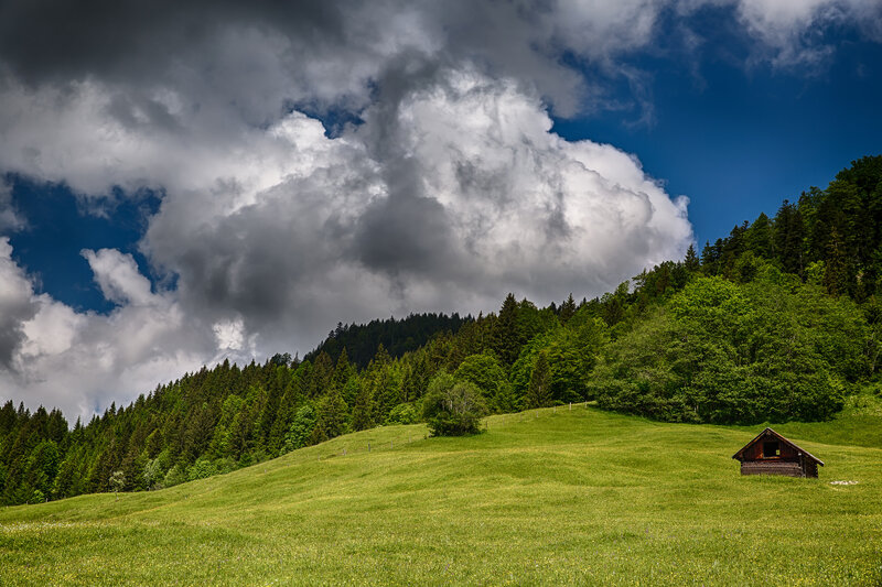 Wooden Hut on Hillside — Green, Dramatic