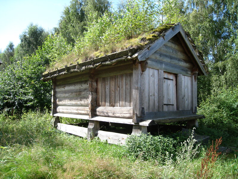 Wooden Hut with Grass Roof