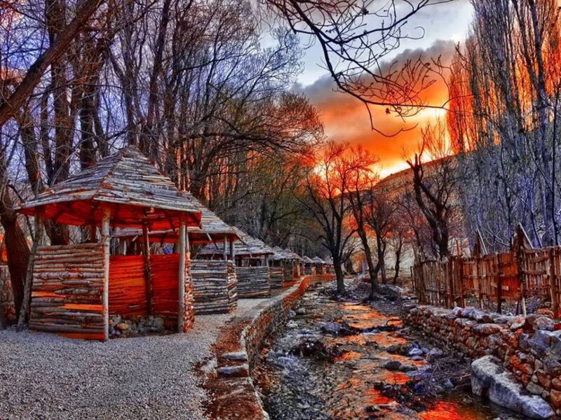 Wooden Huts by Stream — Orange