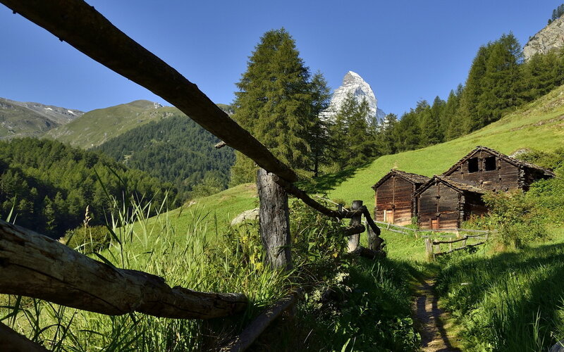 Wooden Huts in Alpine Valley