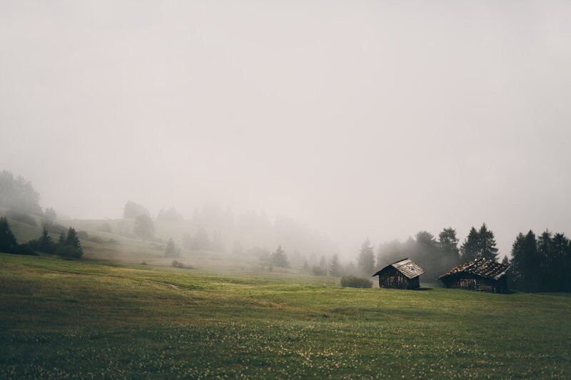 Wooden Huts in Fog