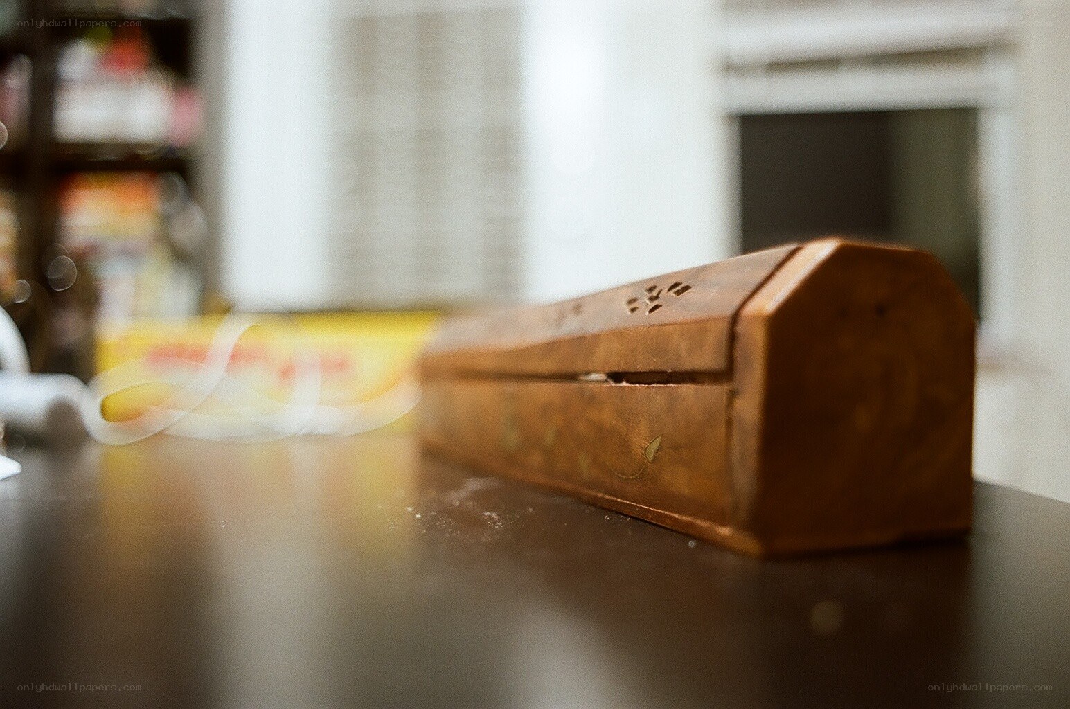 wooden incense box on table