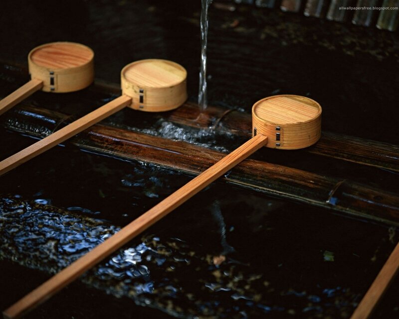 Wooden ladles at a water basin