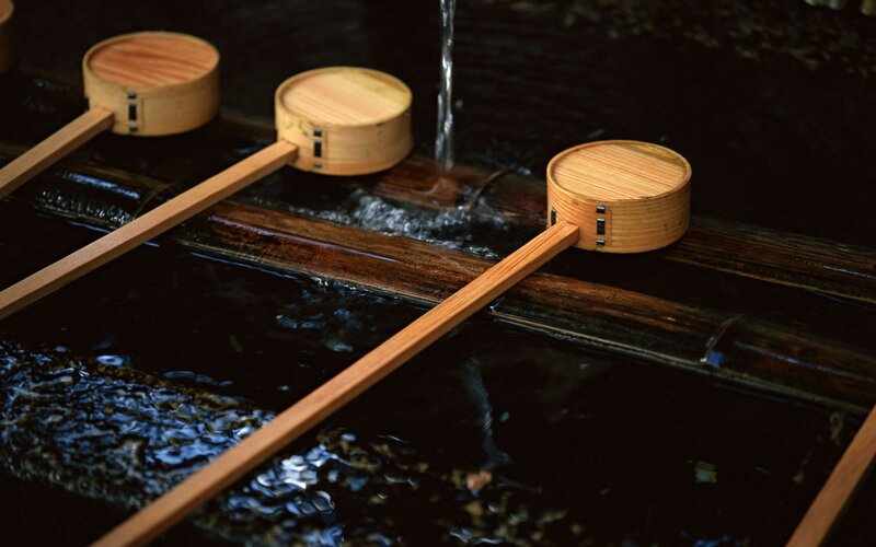 Wooden ladles at water basin