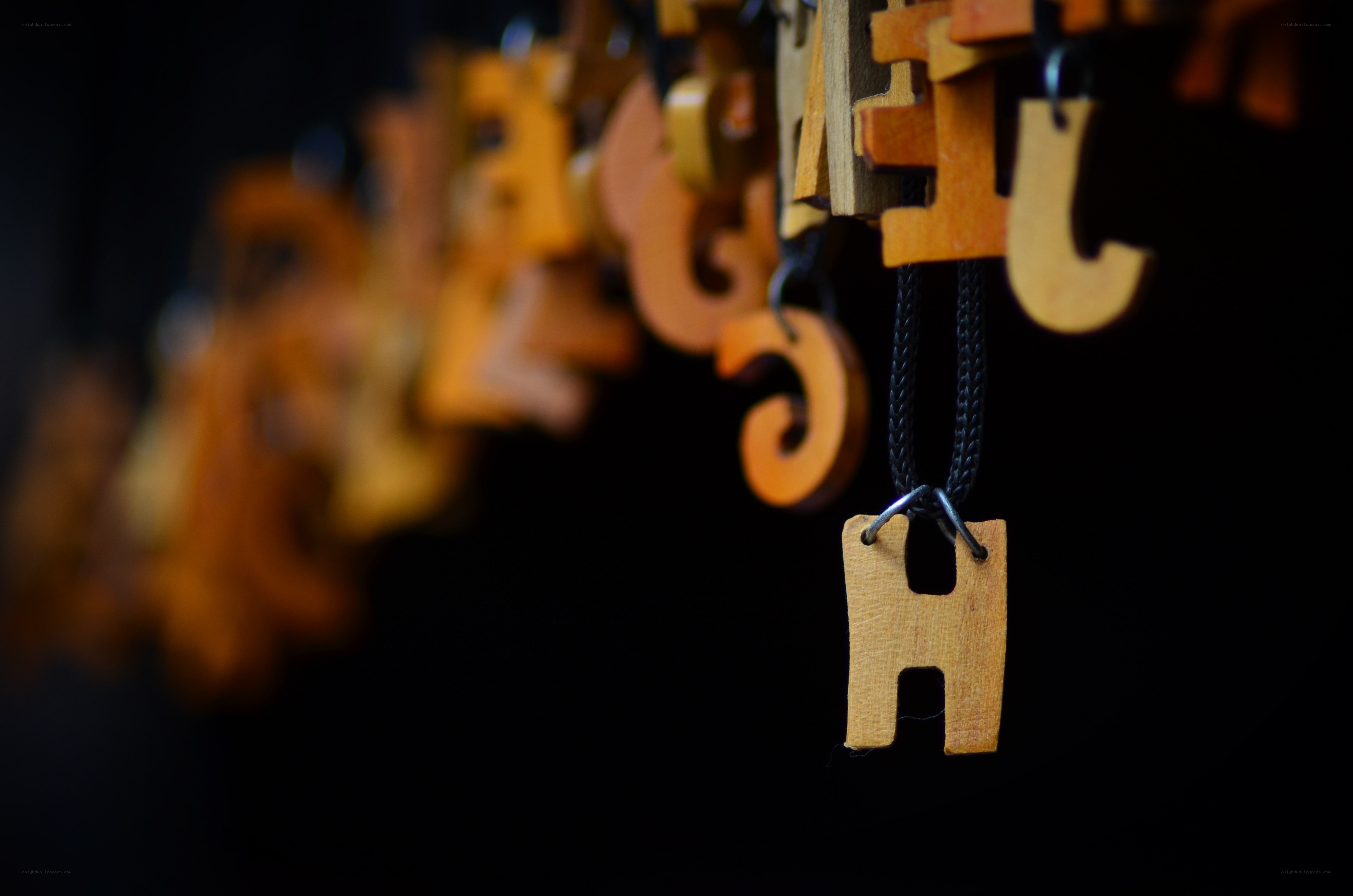 Wooden letter charms hanging