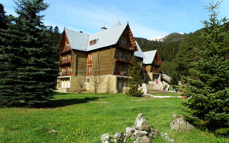 wooden lodge in mountain valley