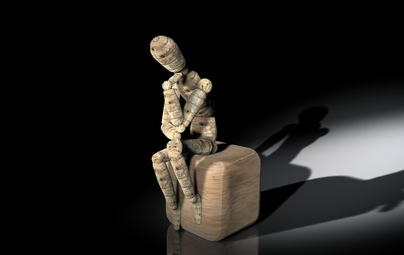 wooden mannequin in thought