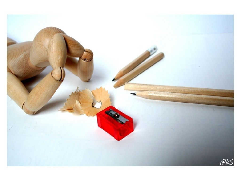 Wooden mannequin with pencils