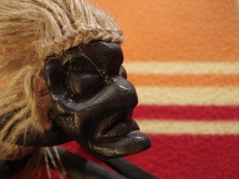 wooden mask with straw hair