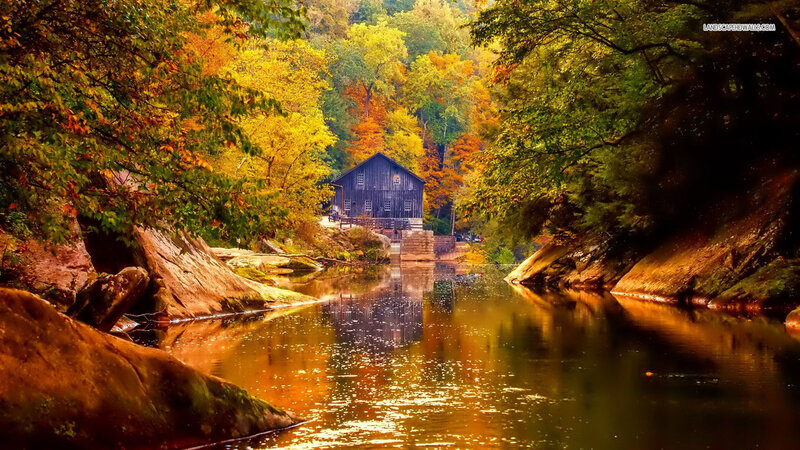 Wooden Mill by River — Orange, Serene, Autumn, Photograph, Trees, Rocks