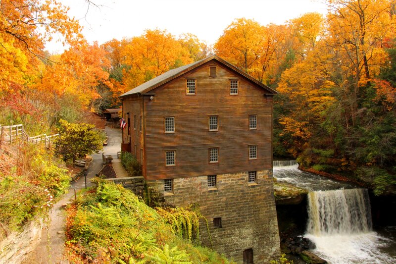 Wooden Mill by Waterfall — Orange, Serene, Autumn, Photograph, Fall Foliage, River, American Flag
