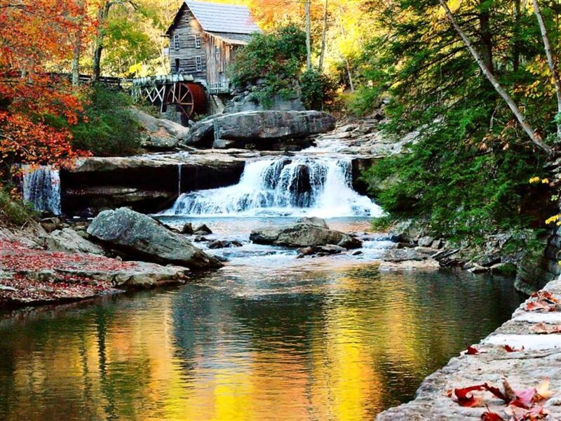 Wooden Mill by Waterfall — Yellow