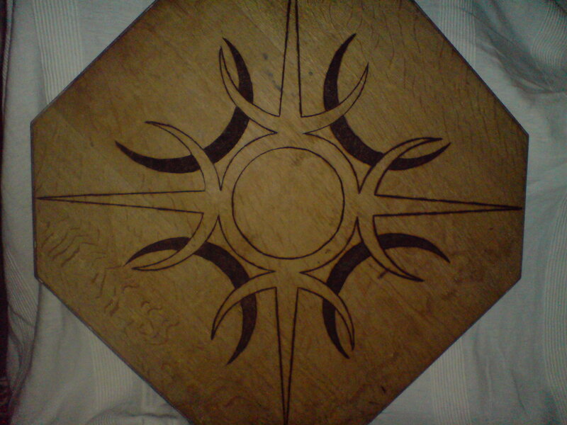 Wooden Octagon with Sun Design
