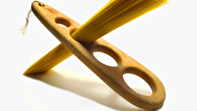 Wooden pasta holder with spaghetti
