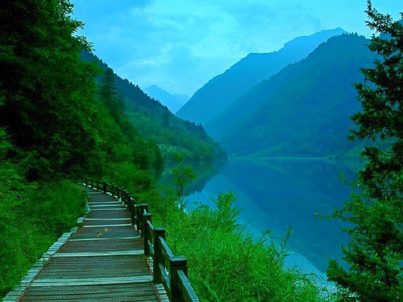Wooden path by a mountain lake