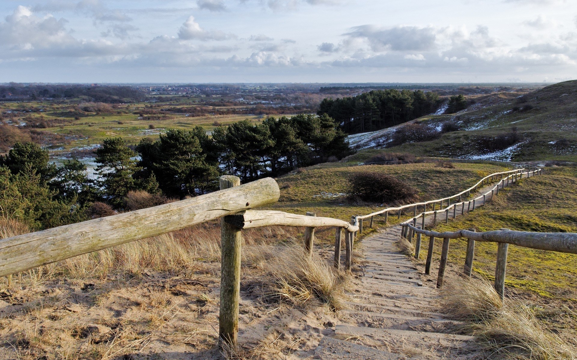 Wooden path on a sandy hill