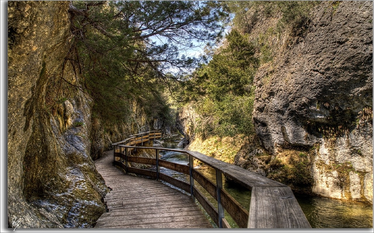 Wooden path through a rocky canyon