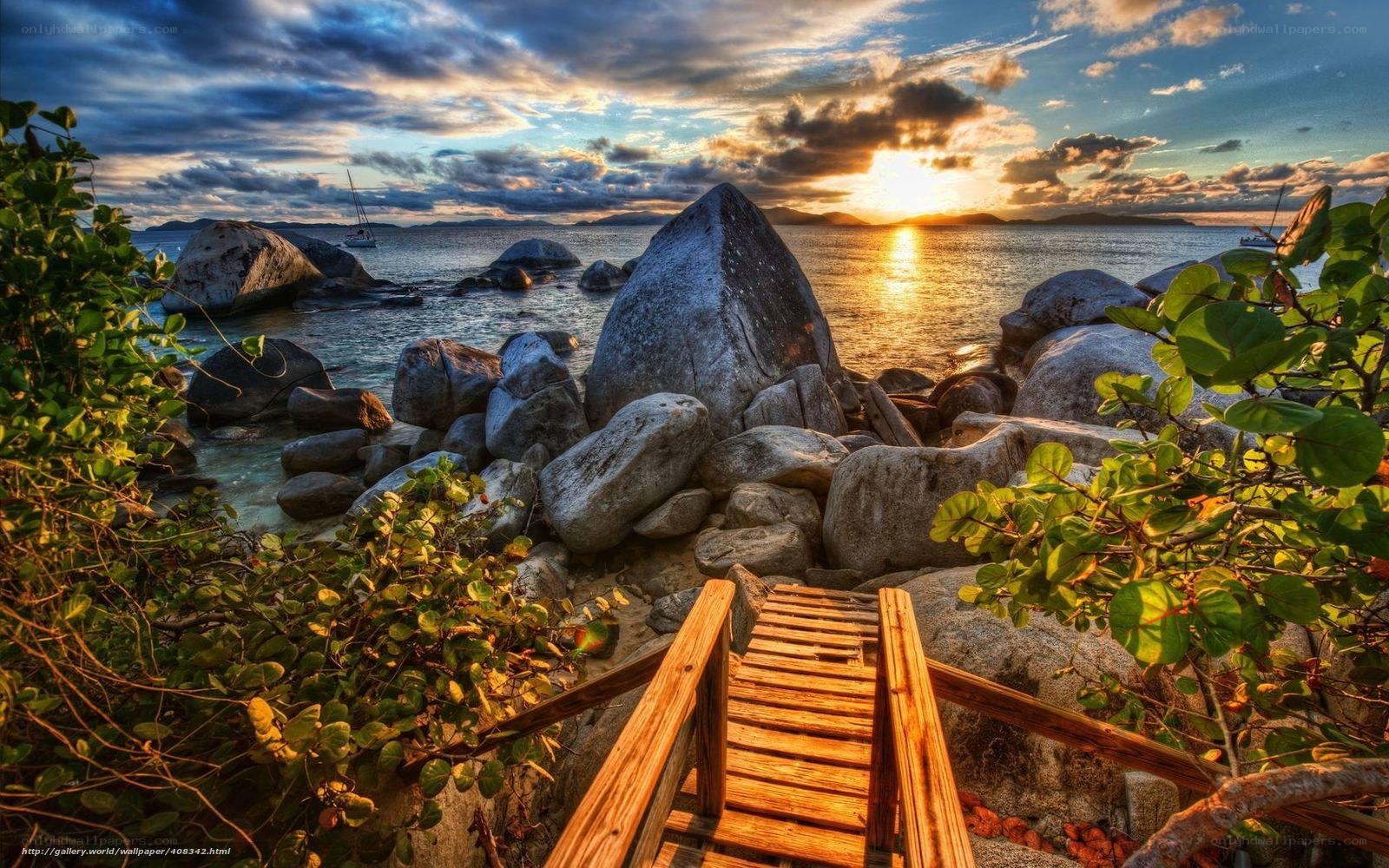 Wooden path to rocky beach