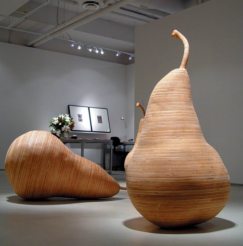 Wooden pear sculptures in gallery