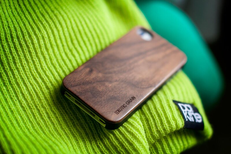 Wooden phone case on green sweater