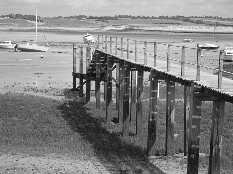 Wooden pier at low tide