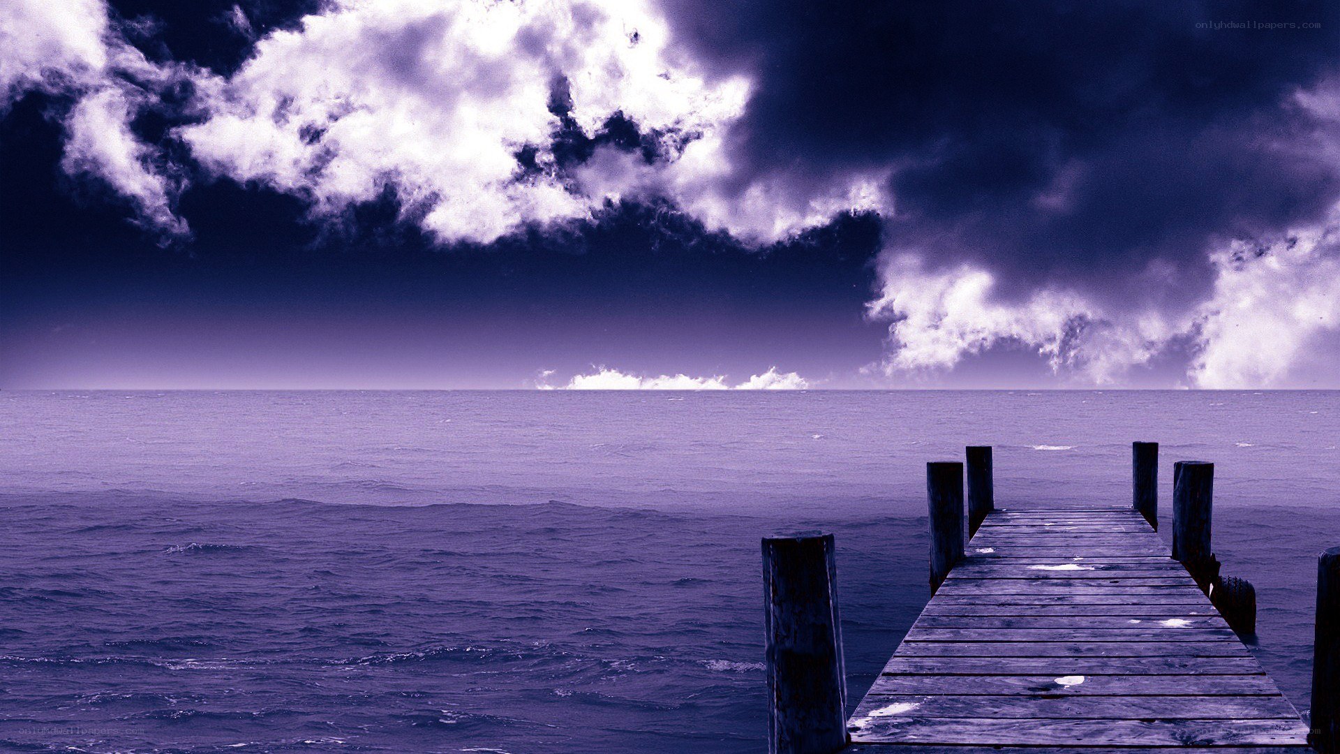 Wooden pier at purple sunset