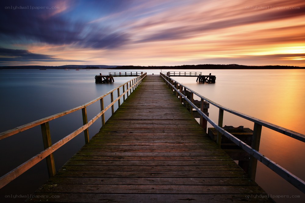 Wooden pier at sunset
