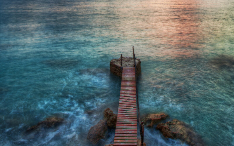 Wooden pier at sunset
